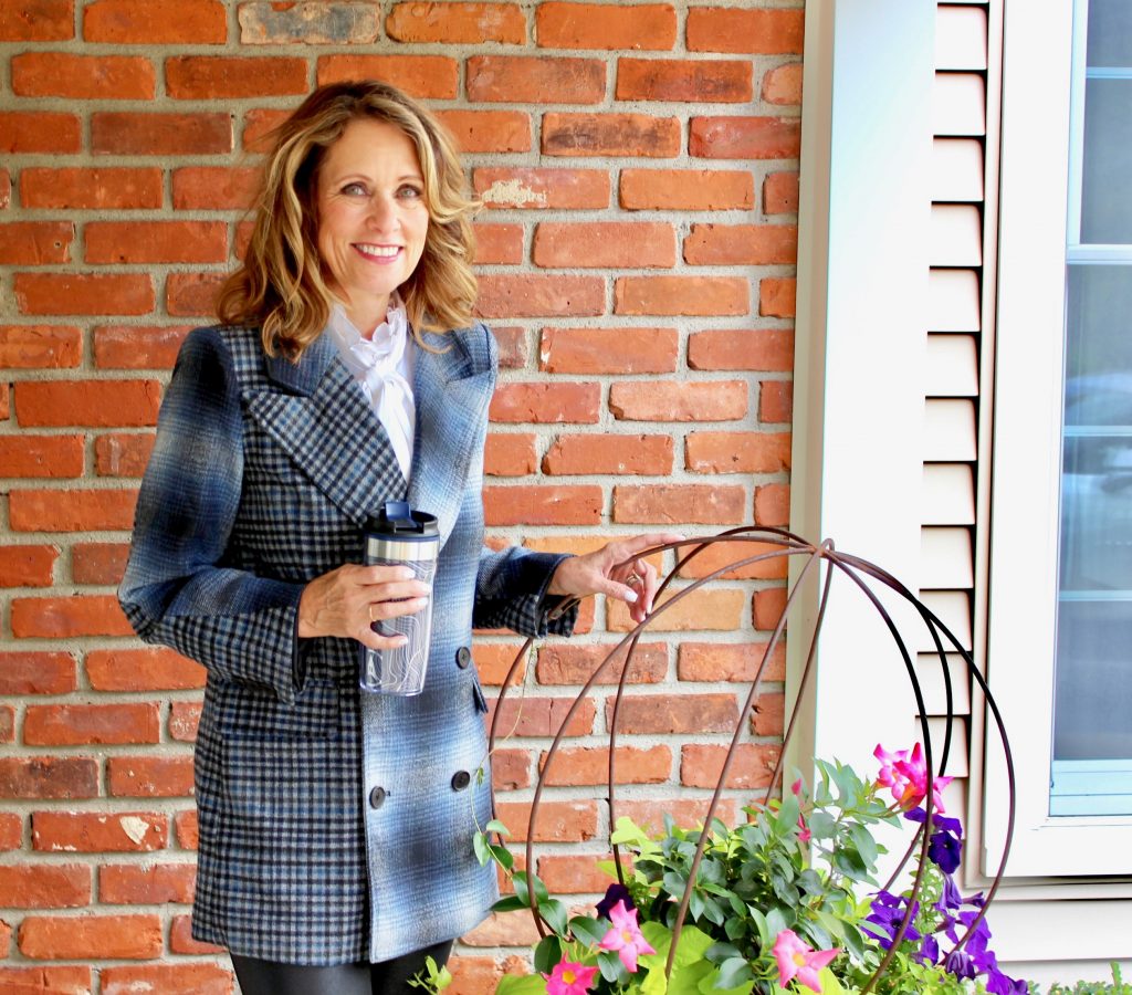 Val is wearing a navy blue plaid blazer by Treasure and Bond