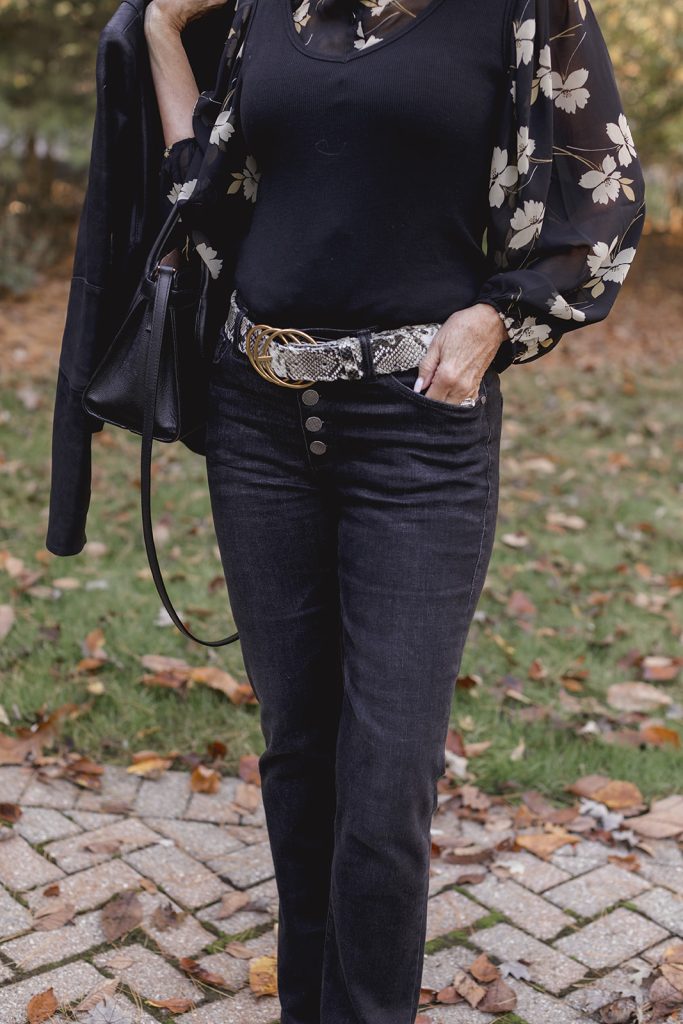 photo of jeans, belt, blouse and tank