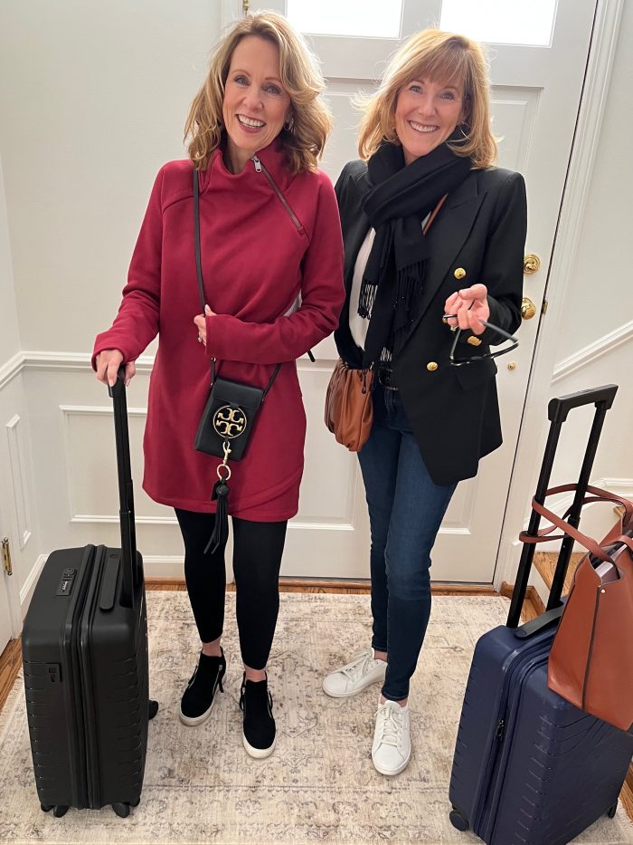 two women with suitcases